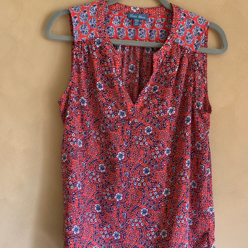 Orange floral sleeveless blouse